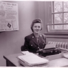 <p>WAC typist with Fort Slocum recruitment drive poster, 1944.</p>